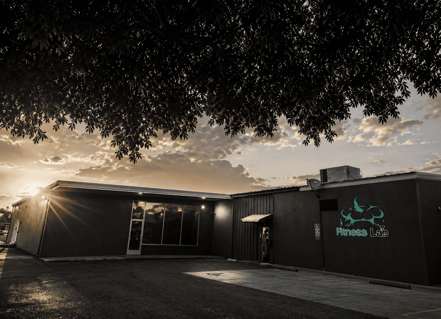 The Fitness Lab building exterior at sunset in Coalinga, California