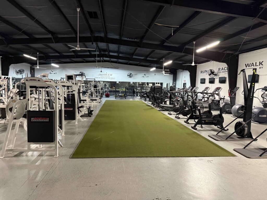 Turf strip and cardio row with bikes, rowers and SkiErg at The Fitness Lab
